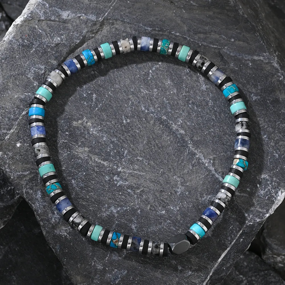 Bohemian bracelet with cylindrical semi-precious stone beads in a hand-woven geometric design.