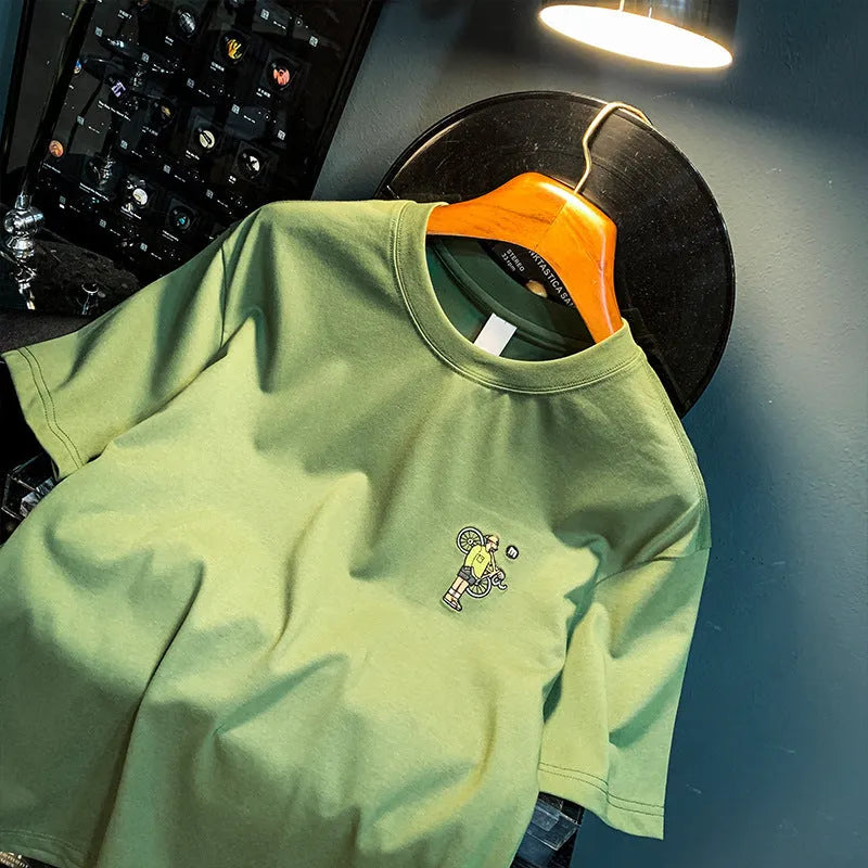 Green men's loose fit T-shirt with a literary print design on the front.