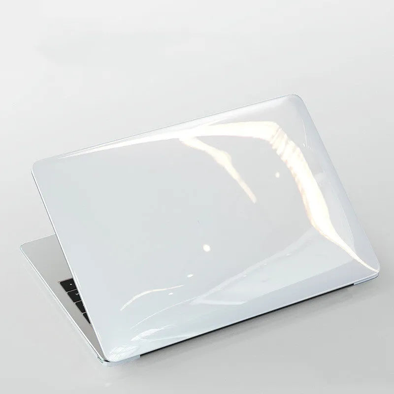 Transparent and black PC protective cases for Apple MacBook Pro 14.2-inch and 16.2-inch laptops.
