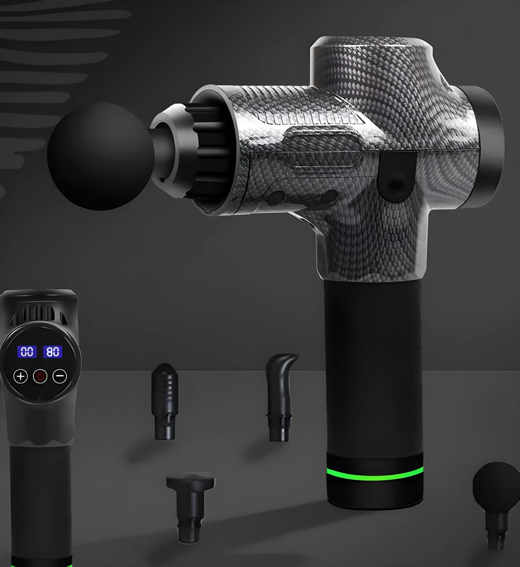 Black electric muscle massage gun with multiple interchangeable heads on a table.