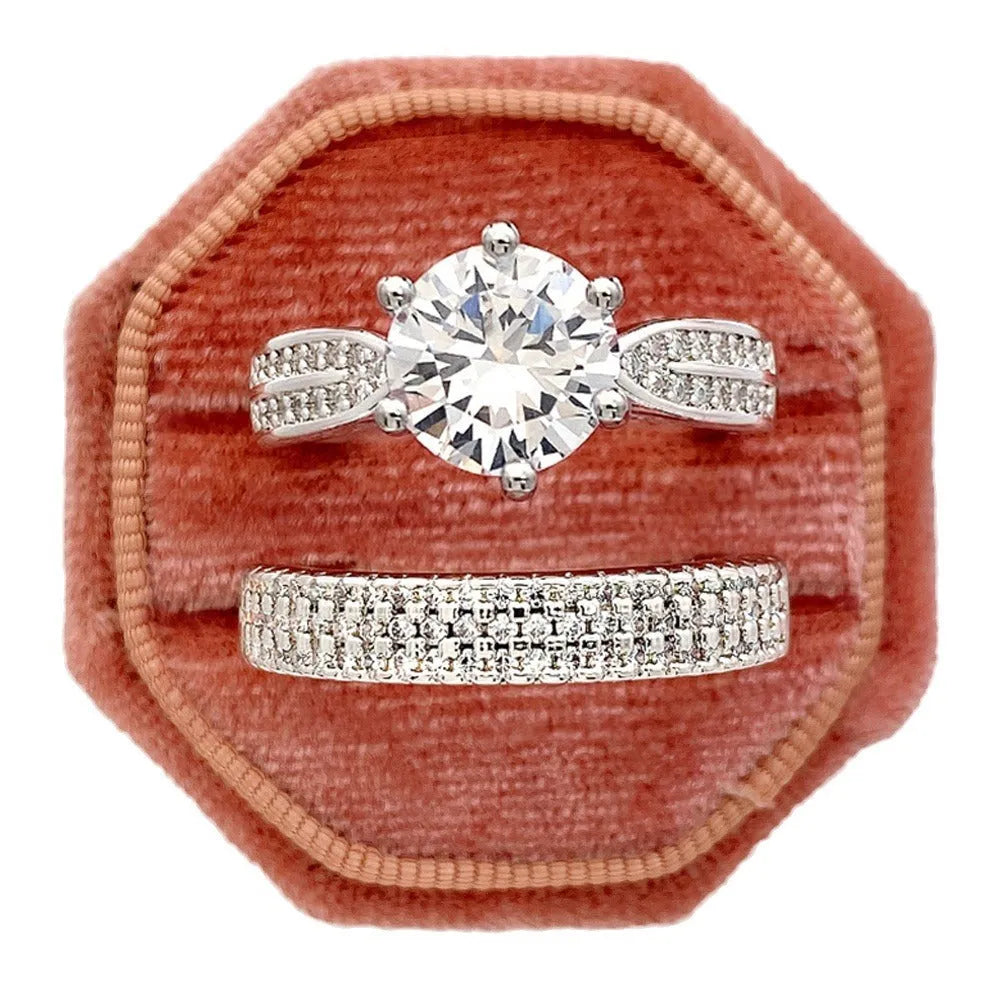 Geometric silver-coloured alloy ring bracelet with a round charm on a white background.