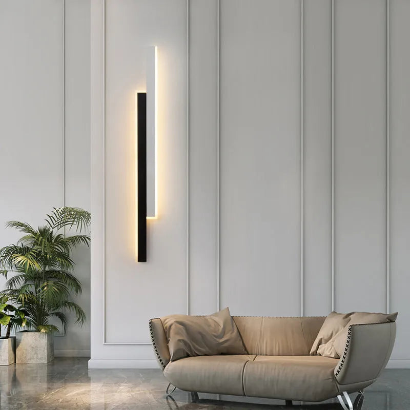 Simple modern wall lamp with a long acrylic shade and grid-free strip light design.