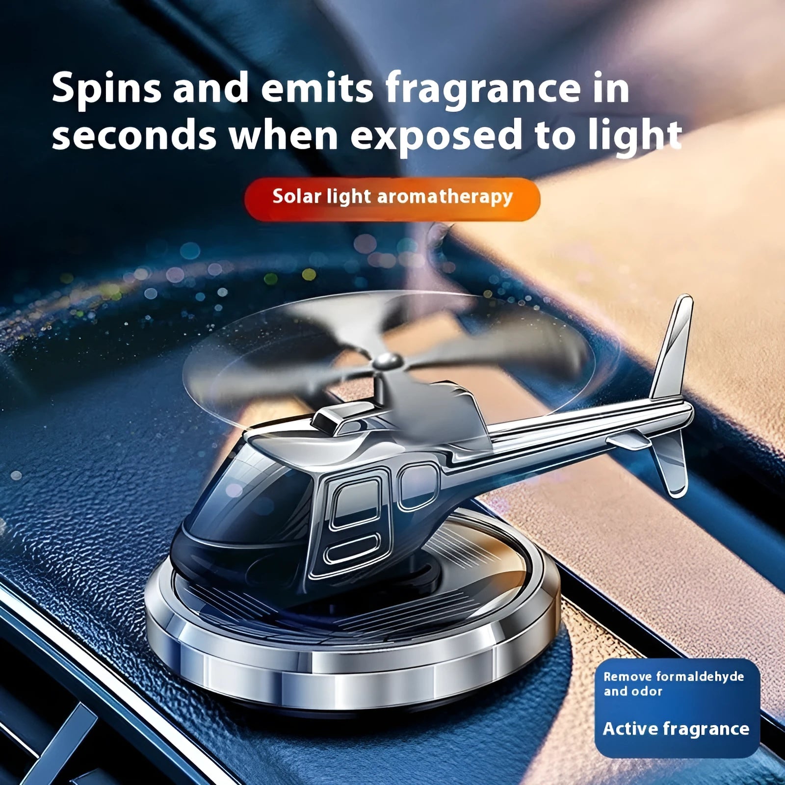 Silver metallic solar-powered helicopter car perfume ornament rotating on a car dashboard