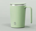 White automatic stirring electric mixing cup with minimalist design and USB cable.