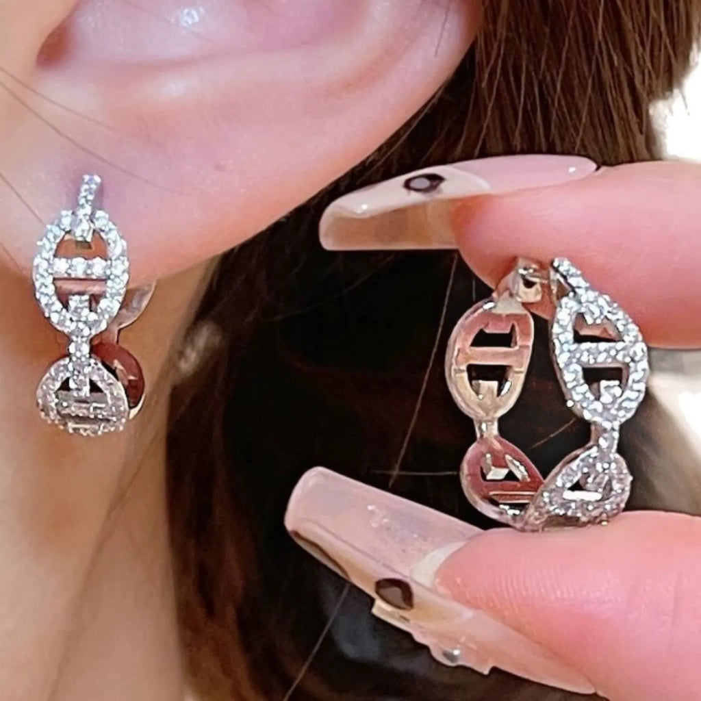 A pair of ladies casual earrings with a diamond design and thick gold plating in silver, gold, or rose gold colour.