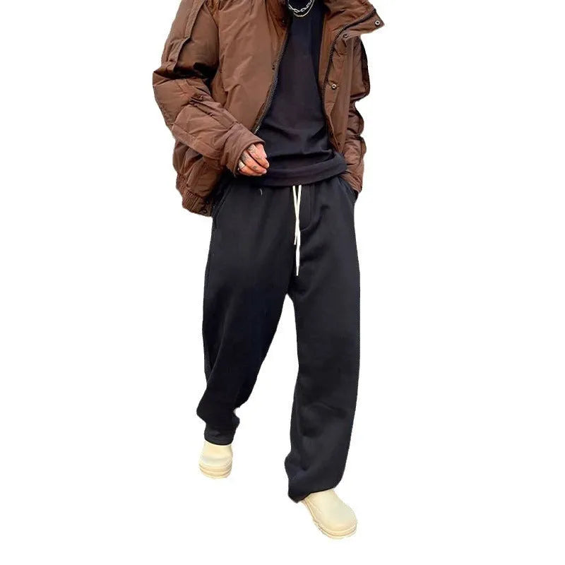 Men's casual sweatpants in black cotton loose fit with elastic waist and mid rise side view