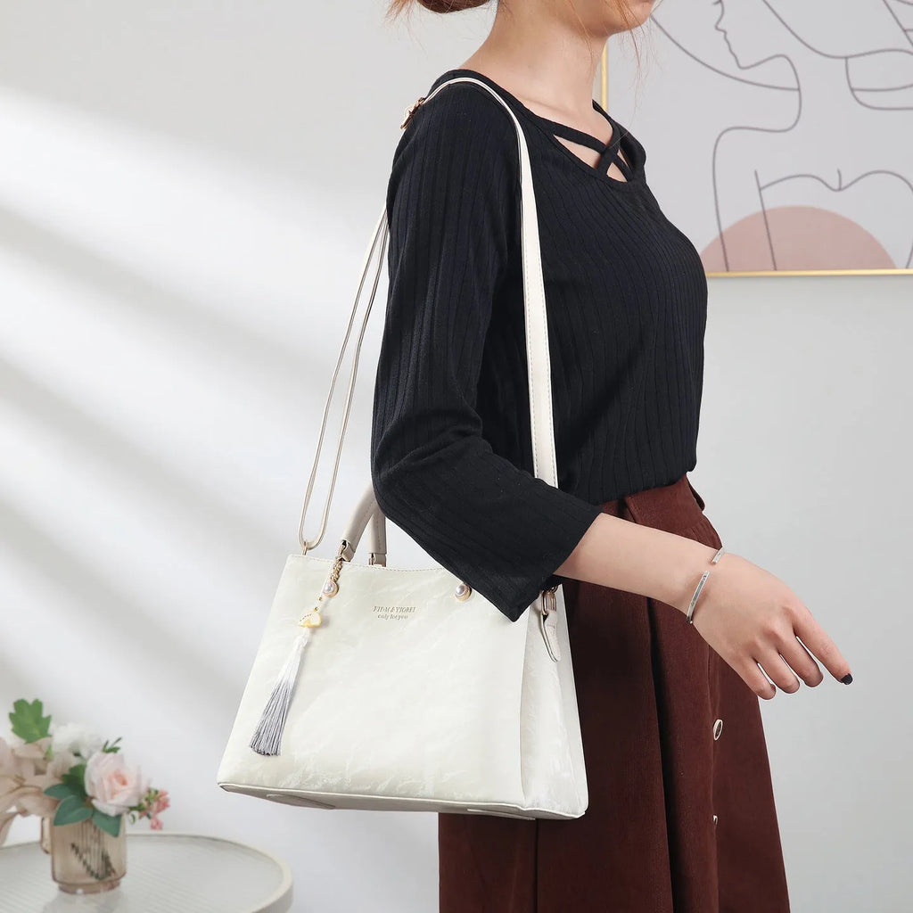 Women's large square shoulder bag in PU leather with a slit pocket, shown in beige colour.