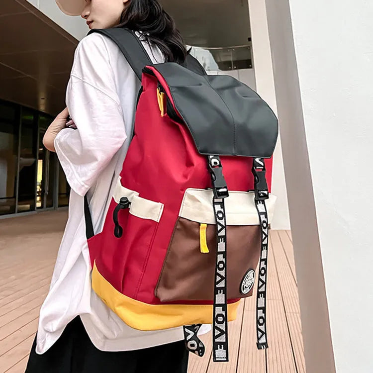Oxford cloth backpack in black, green, or red with multiple carry handles and straps.
