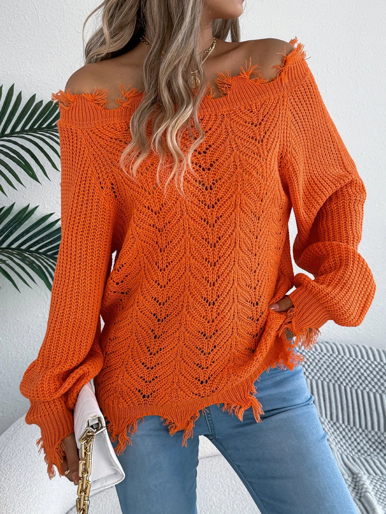 Hollow-out cut off-the-shoulder pullover sweater in artificial wool shown in black, orange, and white colours