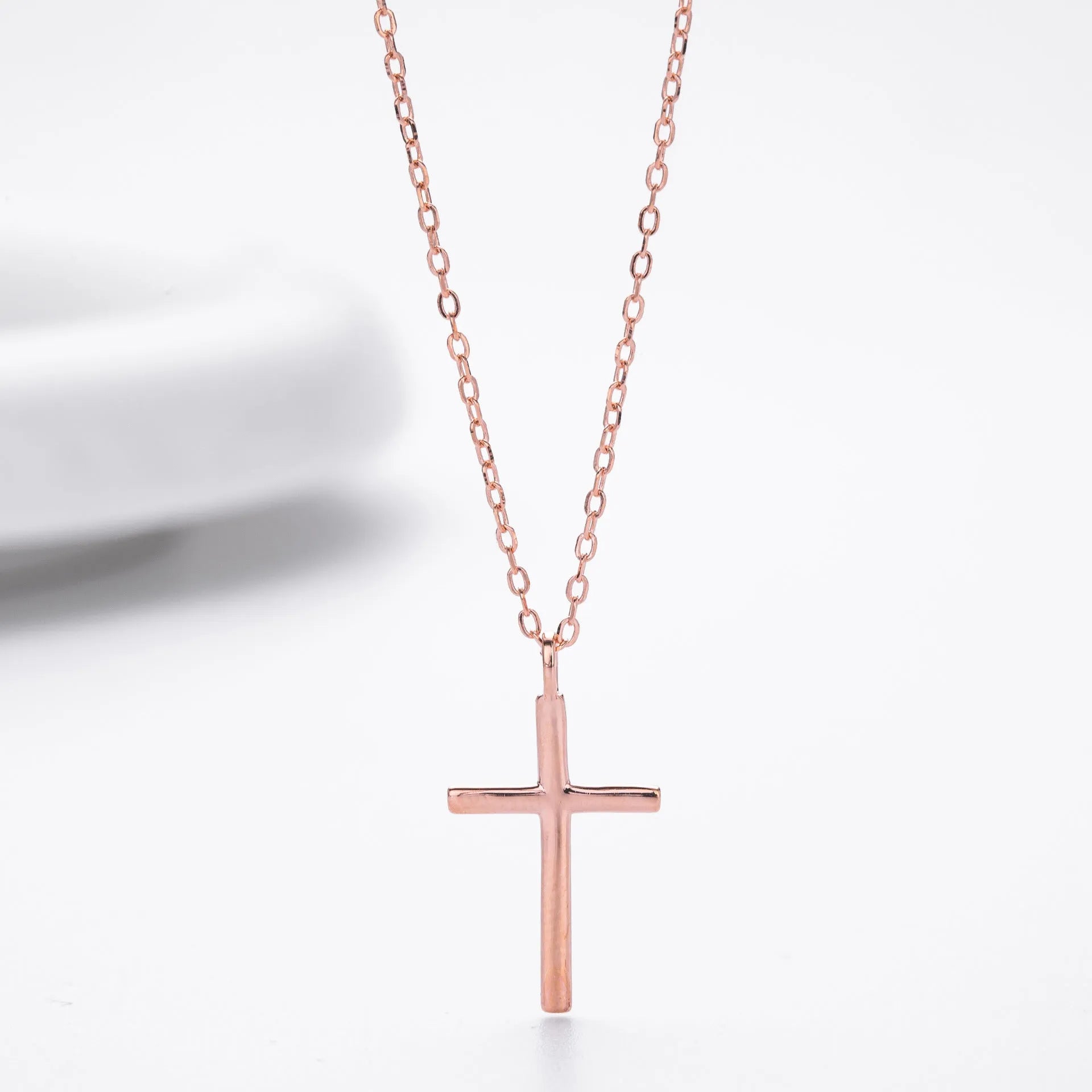 S925 sterling silver cross pendant necklace on an O-shaped chain in a gold electroplated finish.