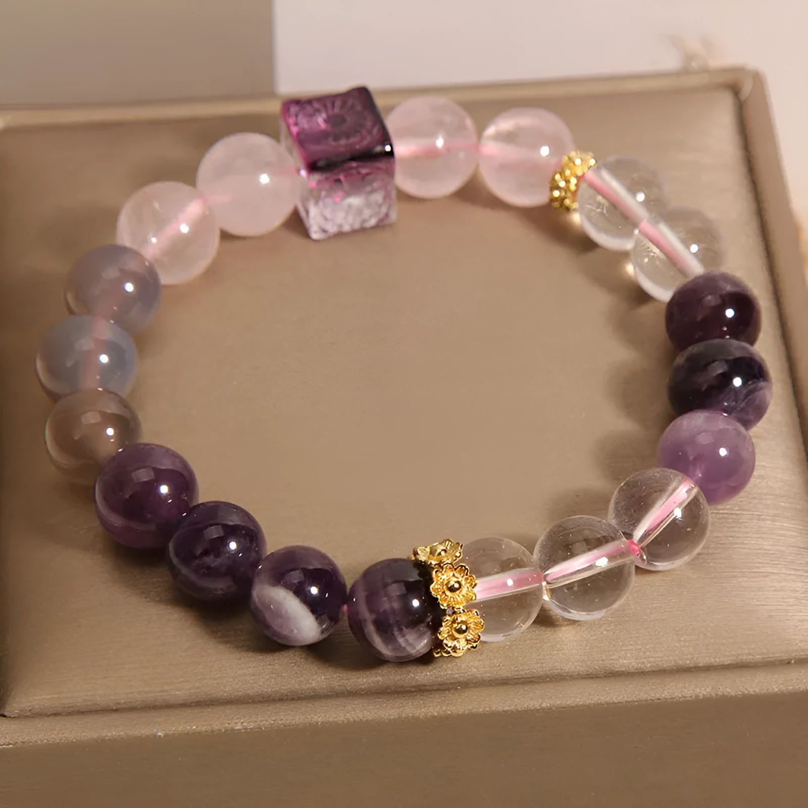 Purple women's bracelet with natural amethyst stones and rhinestones on a 10mm wide crystal band.