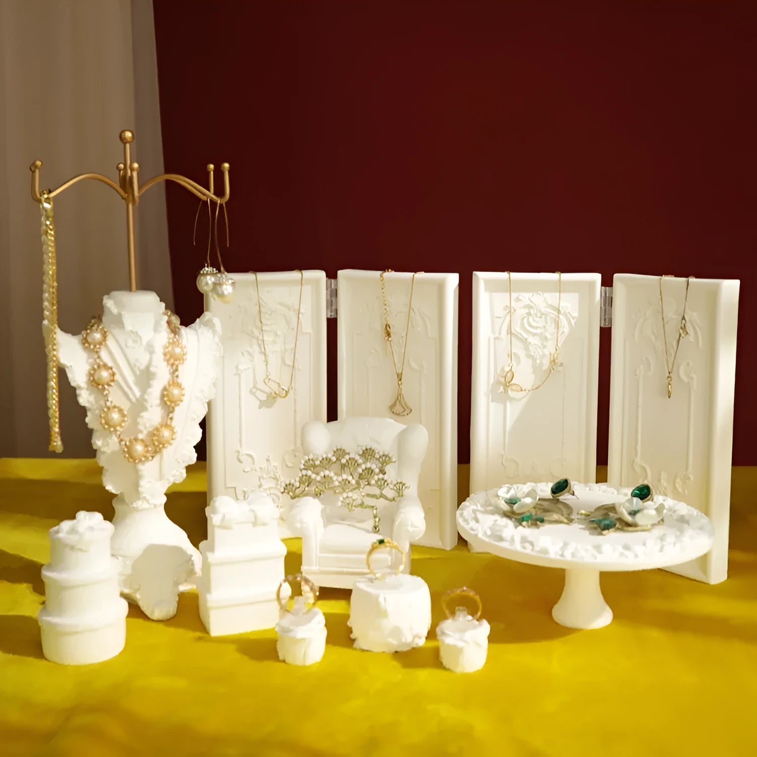 White plaster retro jewellery display stand with three layers, neutral background for necklace display