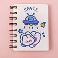 Compact astronaut series flip notebook with space-themed cover, shown closed.