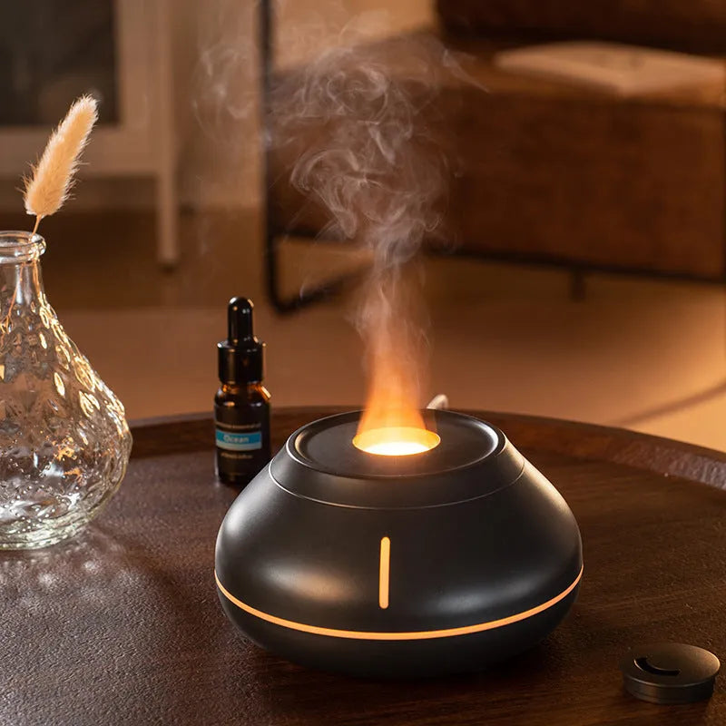 Colourful flame simulation aroma diffuser humidifier in black resin with LED lighting effect