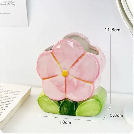 Ceramic pen holder box with floral pattern for desk organisation.