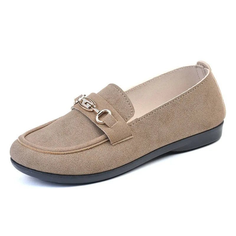 Gommino women's black slip-on casual shoes with a round toe and soft rubber sole on a neutral background.