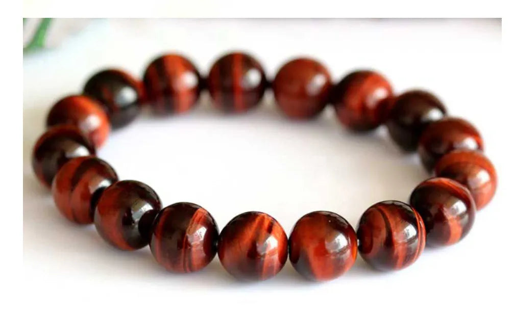 Tiger's eye stone bracelet with lightning cat's eye pattern in a round geometric ethnic style.
