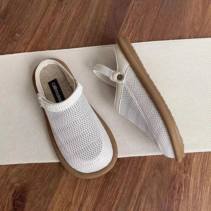 Women's beige linen slip-on shoes with mesh lining, round toe, and rubber sole on a neutral background.