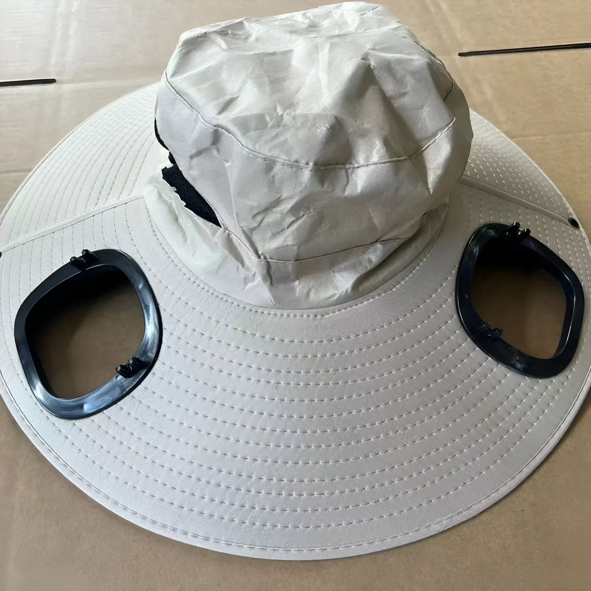 Men's grey large eave cap with integrated solar fan on crown for outdoor sun protection and cooling.
