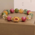 Jade colour tourmaline bracelet for women with round beads on pearl crystal base and rhinestone details