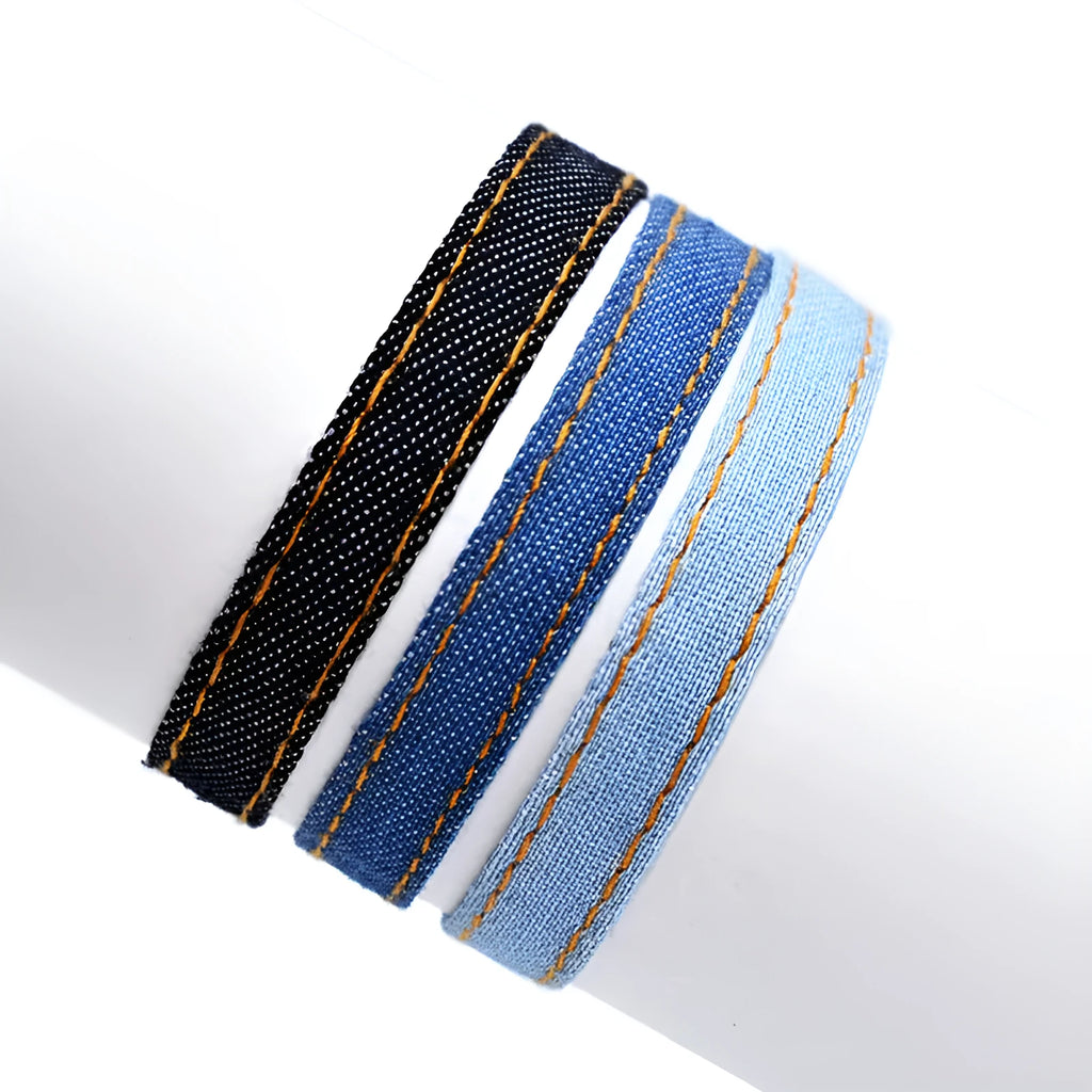 Handmade denim bracelet carrying strap shown in one of eleven available colour options with mixed material construction