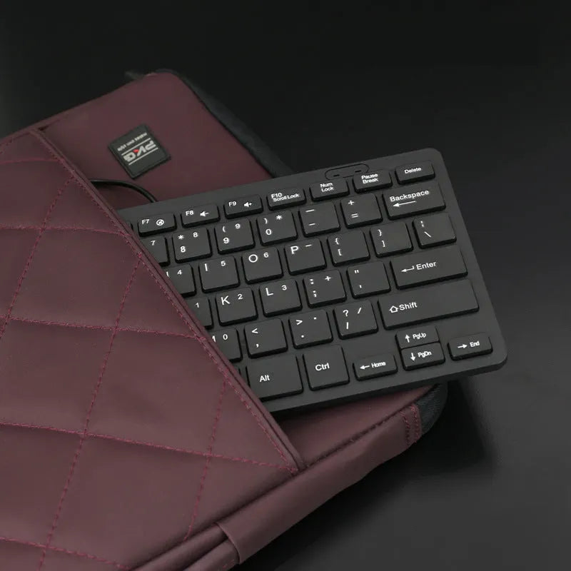 Mini USB wired keyboard in choice of black, white, pink or blue colours with compact design