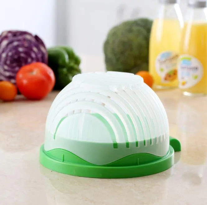 Blue salad cutter bowl with chopper lid and serving plate base for vegetable preparation