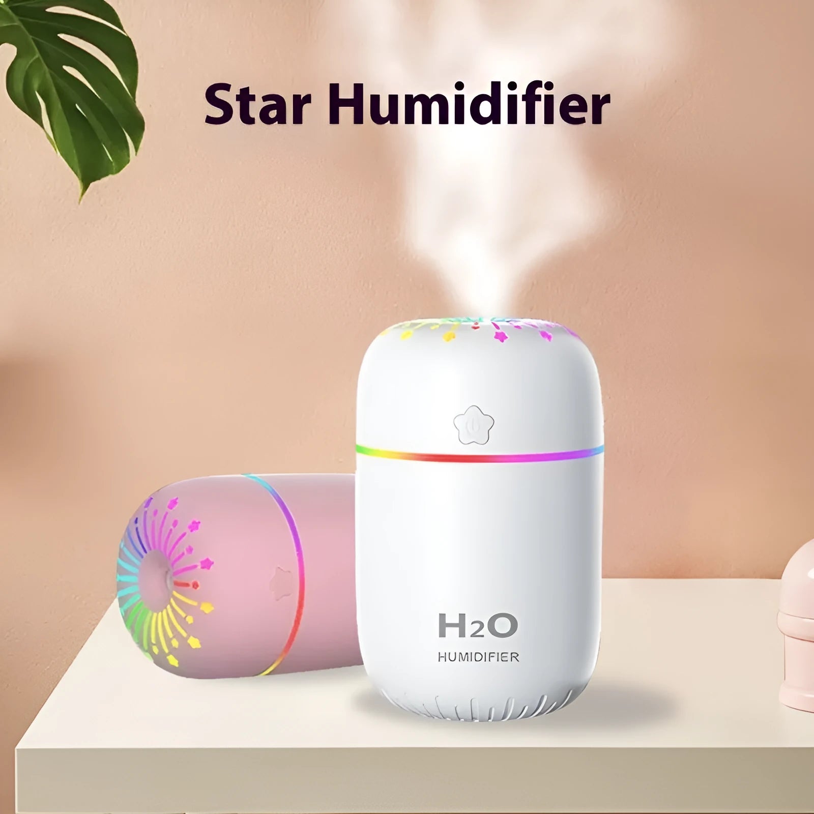 White USB mini humidifier with 300ml tank on a desk next to a laptop.