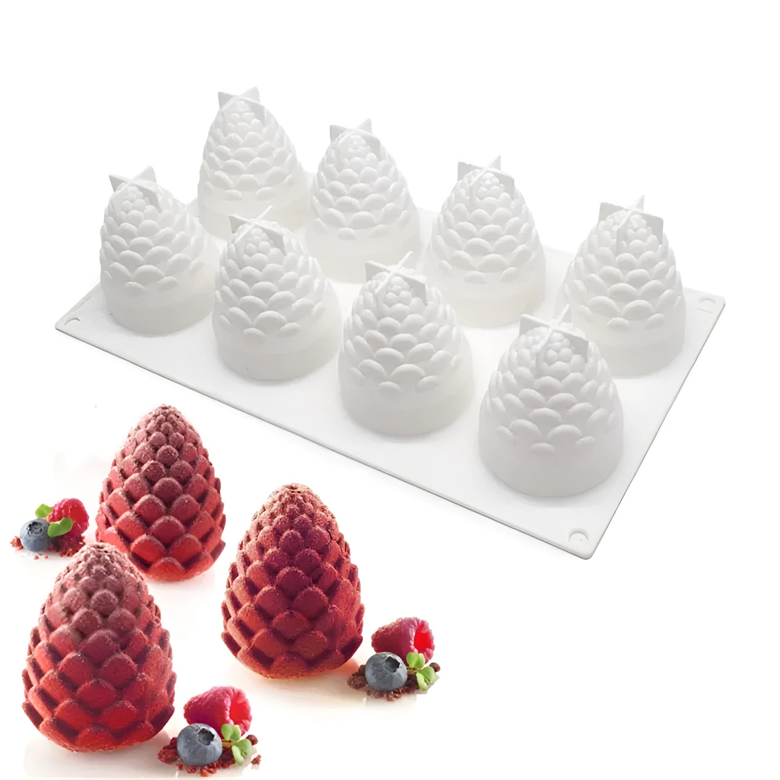 Set of six silicone baking moulds shaped as pineapples, pine cones, and pears on a kitchen counter.