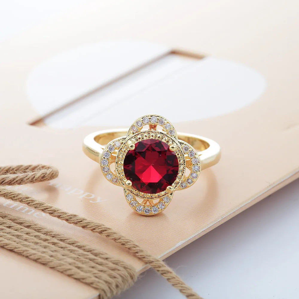 Copper ring with a silver-toned zircon fruit-shaped inlay on a band.