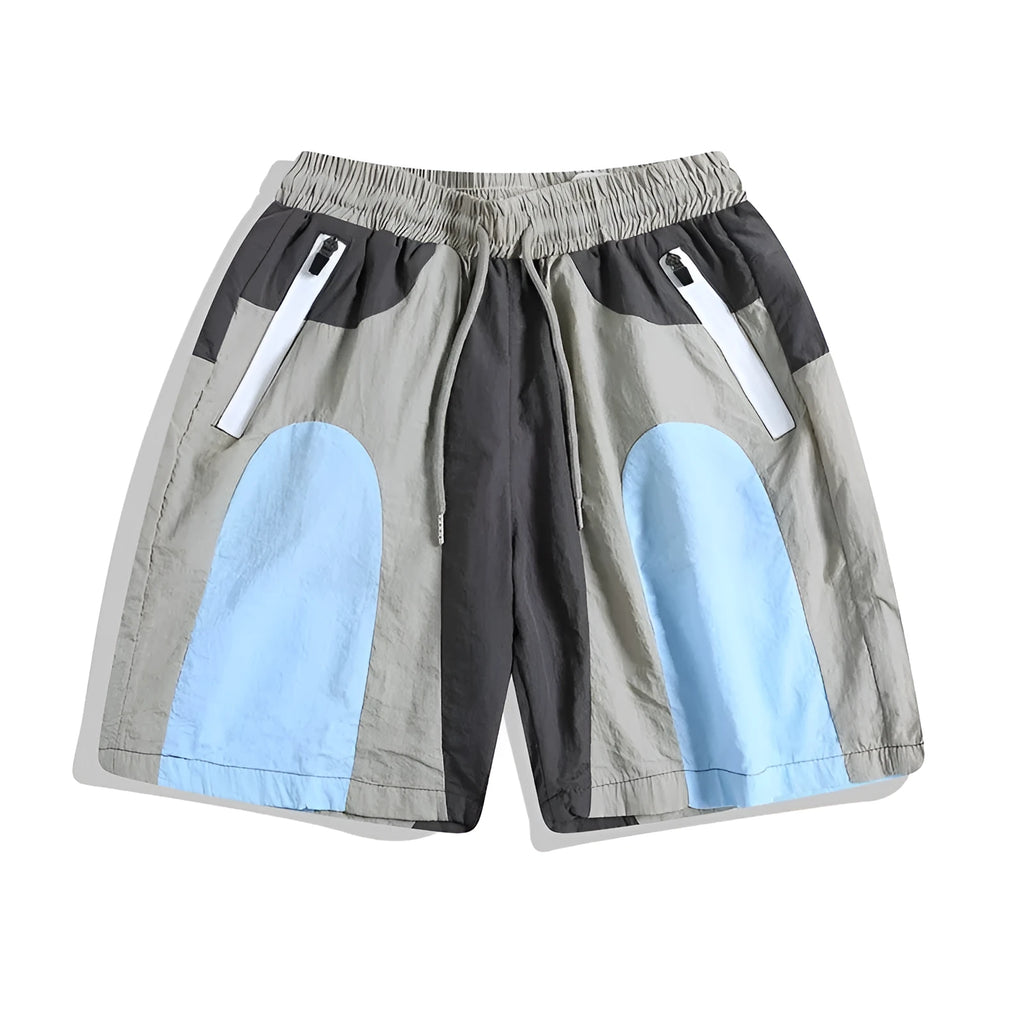 Man wearing blue patchwork loose-fit quick-drying casual sports shorts.