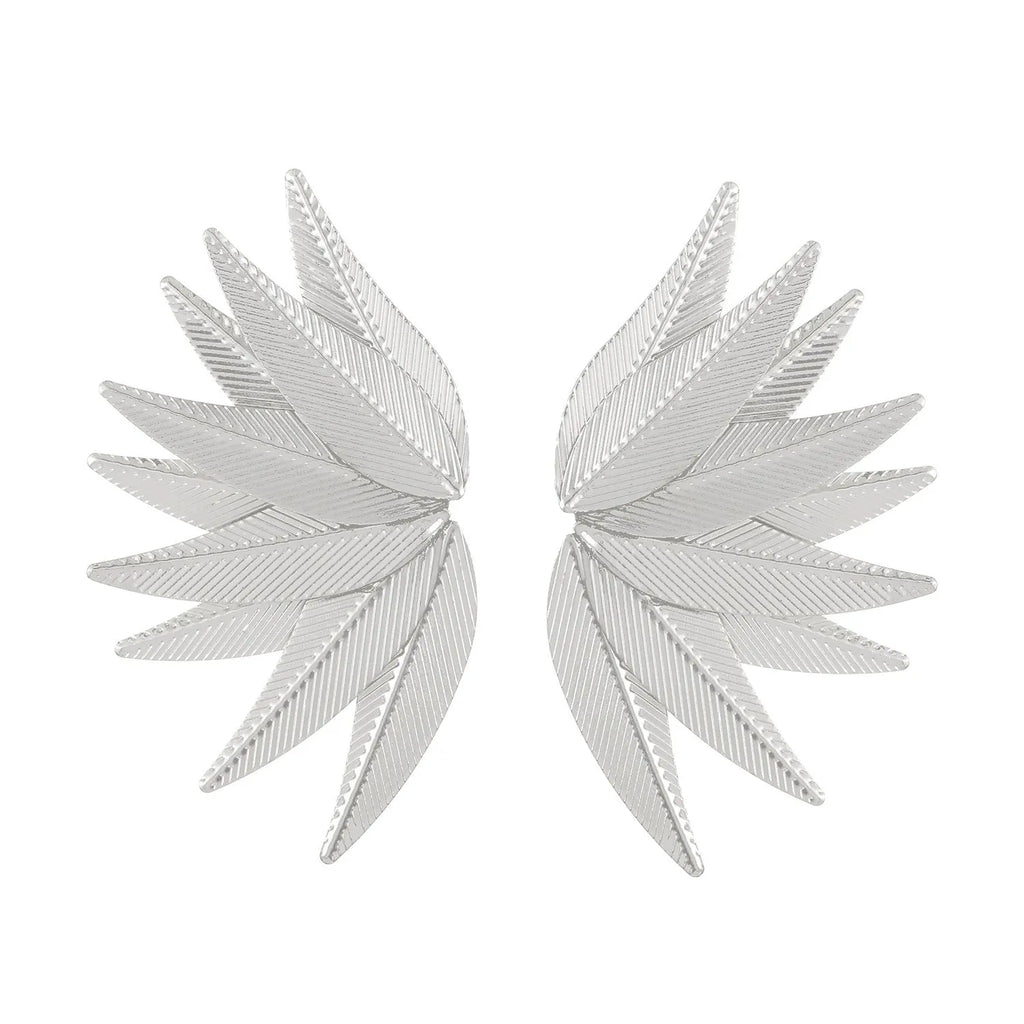 A pair of gold or white alloy earrings shaped like a leaf.