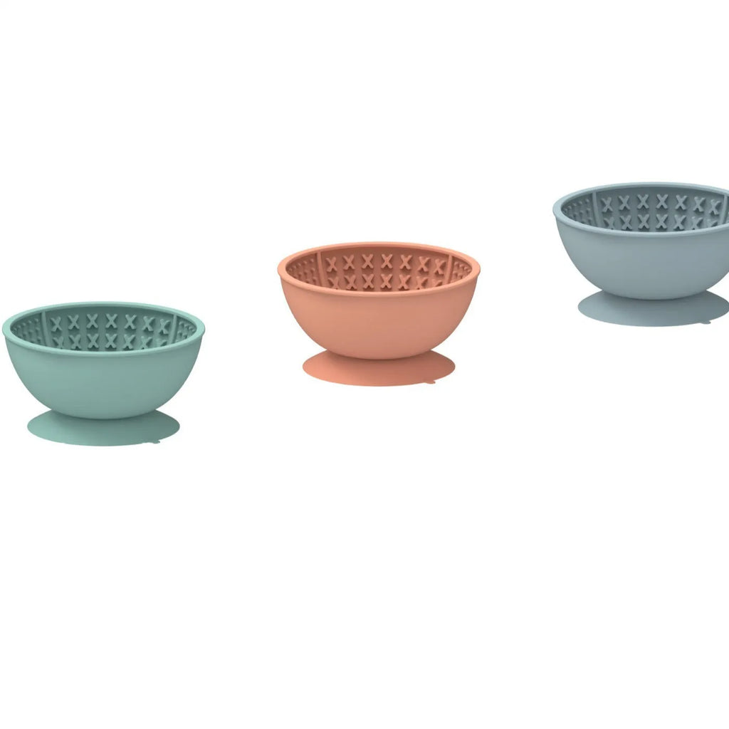 Cyan silicone pet bowl with textured licking mat surface and suction cup base.