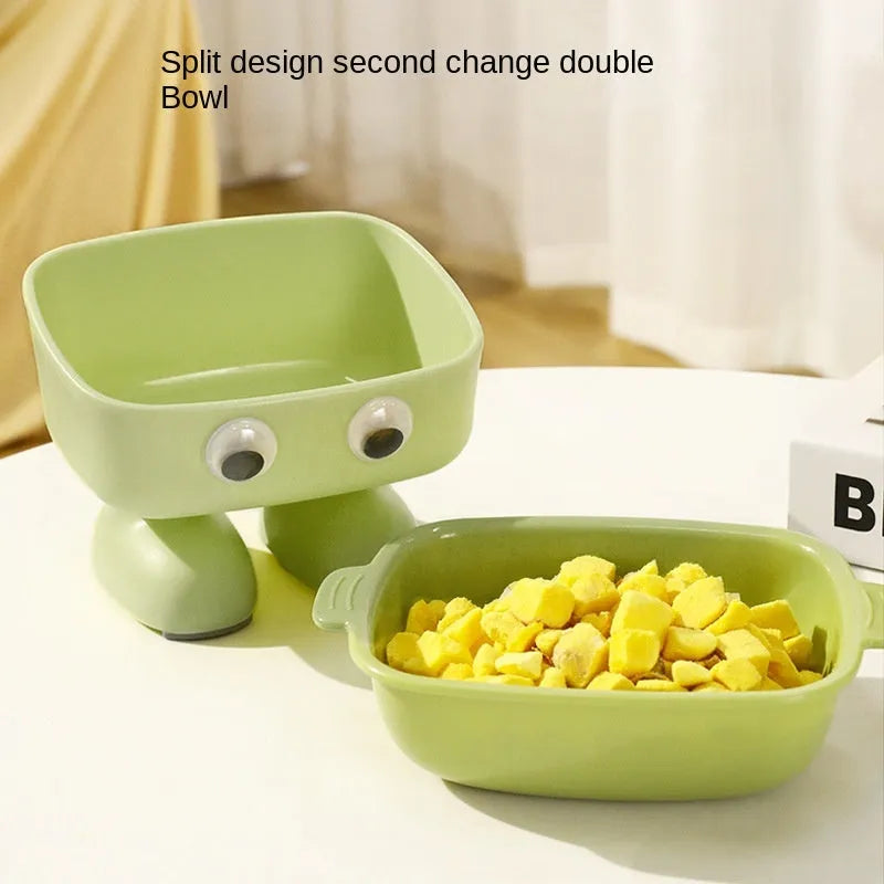 Green robot-shaped elevated cat bowl with tilted design and detachable inner section