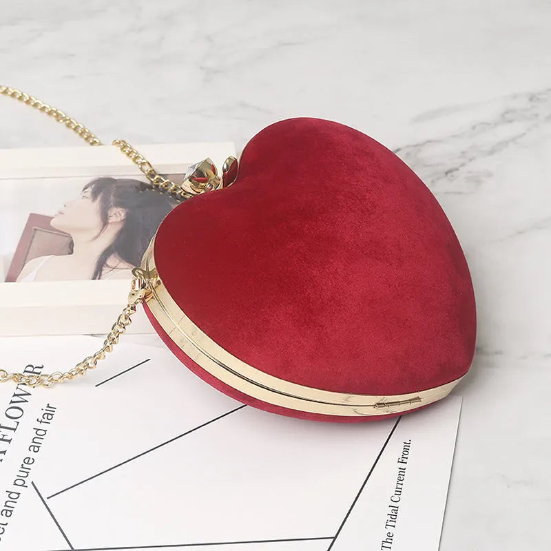 Heart-shaped plush cotton chain bag with card pocket in pink colour on plain background