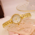 Women's gold vintage style quartz watch with diamond embossed bracelet.