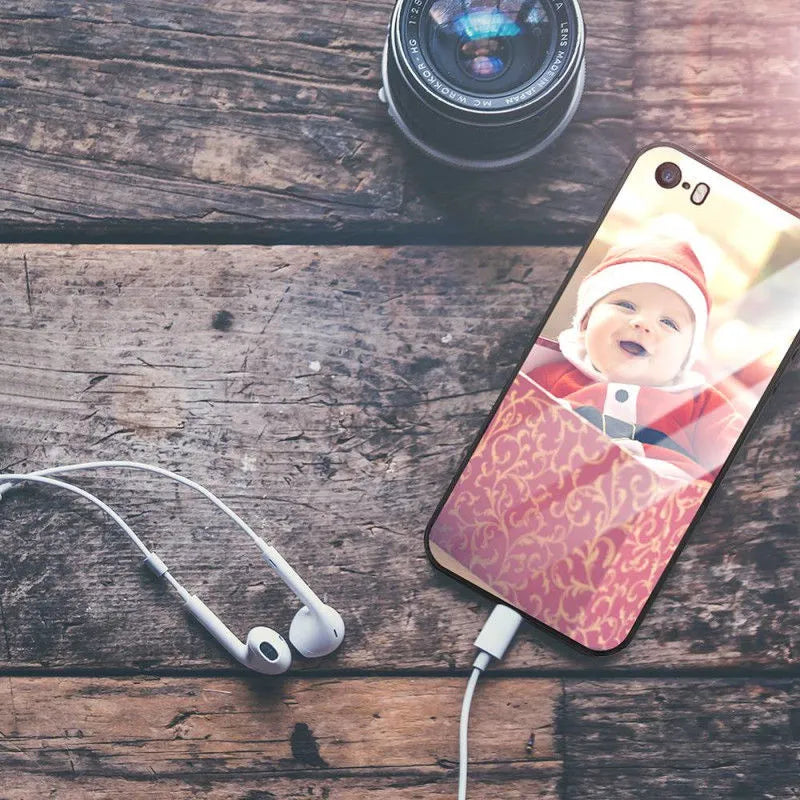 Slim patterned protective case for Apple iPhone with raised edges around screen and camera.