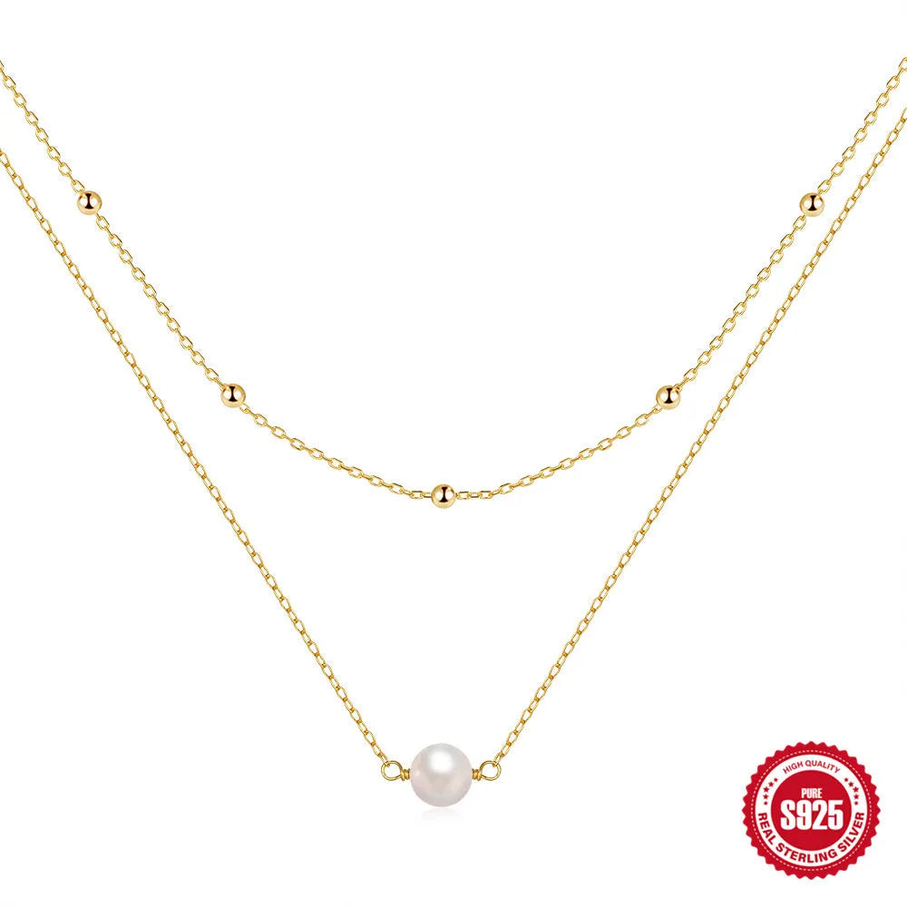 S925 Sterling silver double layer necklace with twin pearls on a ball bead chain, shown in gold and white gold colours.