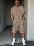 Men's grey hip hop style t-shirt and shorts set with white letter printing on the chest.