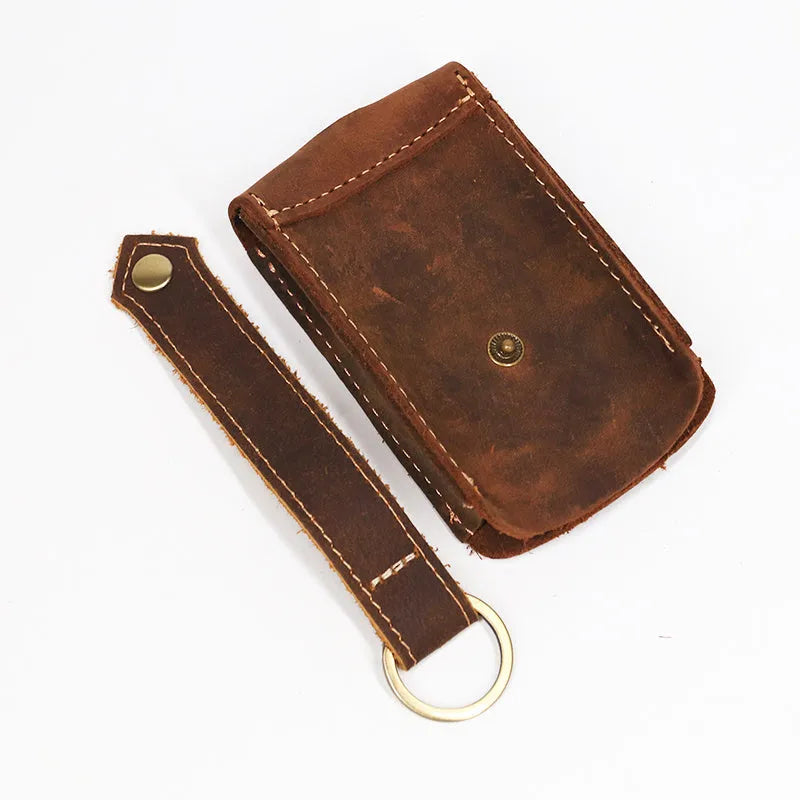 Crazy horse leather key case 7cm by 11.5cm in dark brown colour lying flat