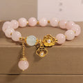 Women's pink crystal flower bracelet with detailed floral bead design on wrist