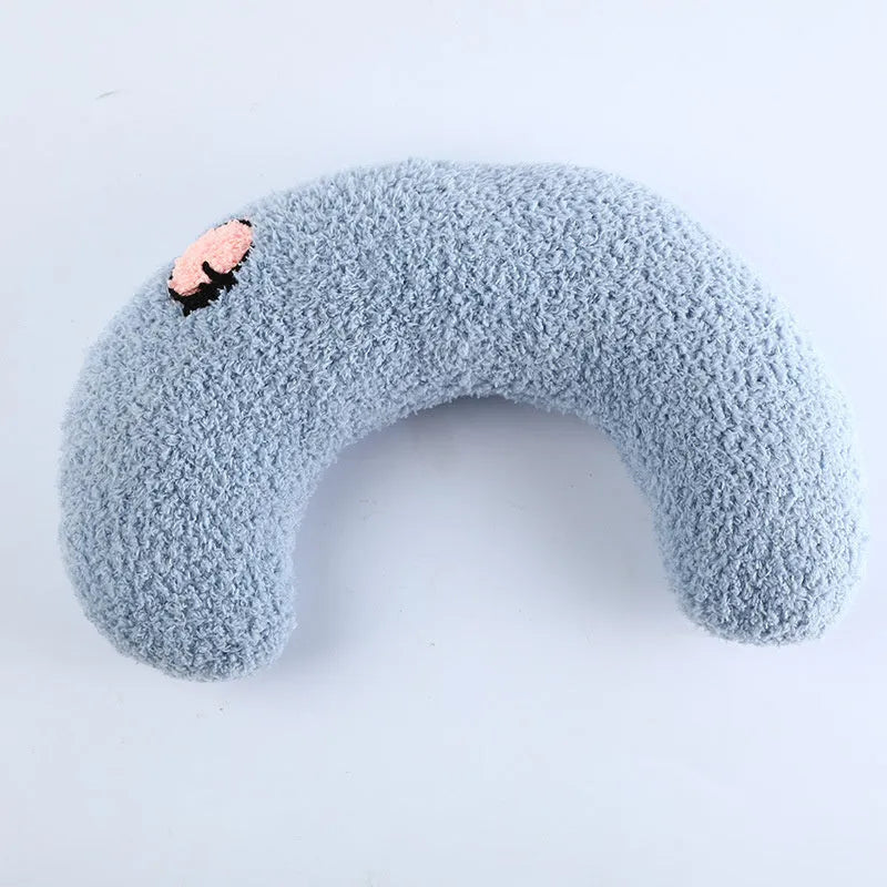 Soft quilted U-shaped cat pillow in blue, 26x18cm, on a clean white background