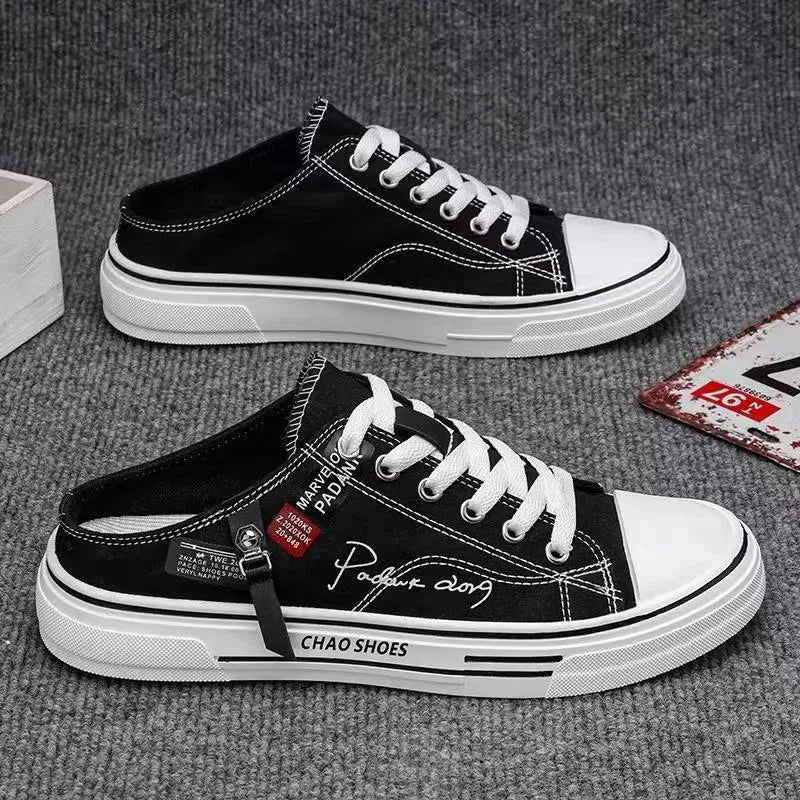 Men's canvas slip-on casual shoes in black colour with round toe and PVC sole