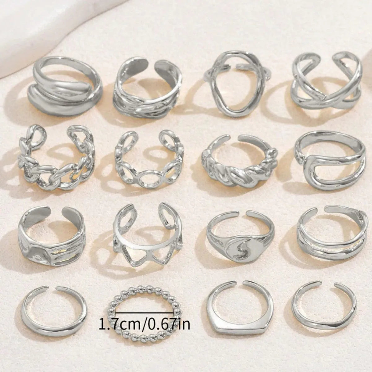 Women's 16-piece open ring suit in silver and gold zinc alloy geometric shape on display