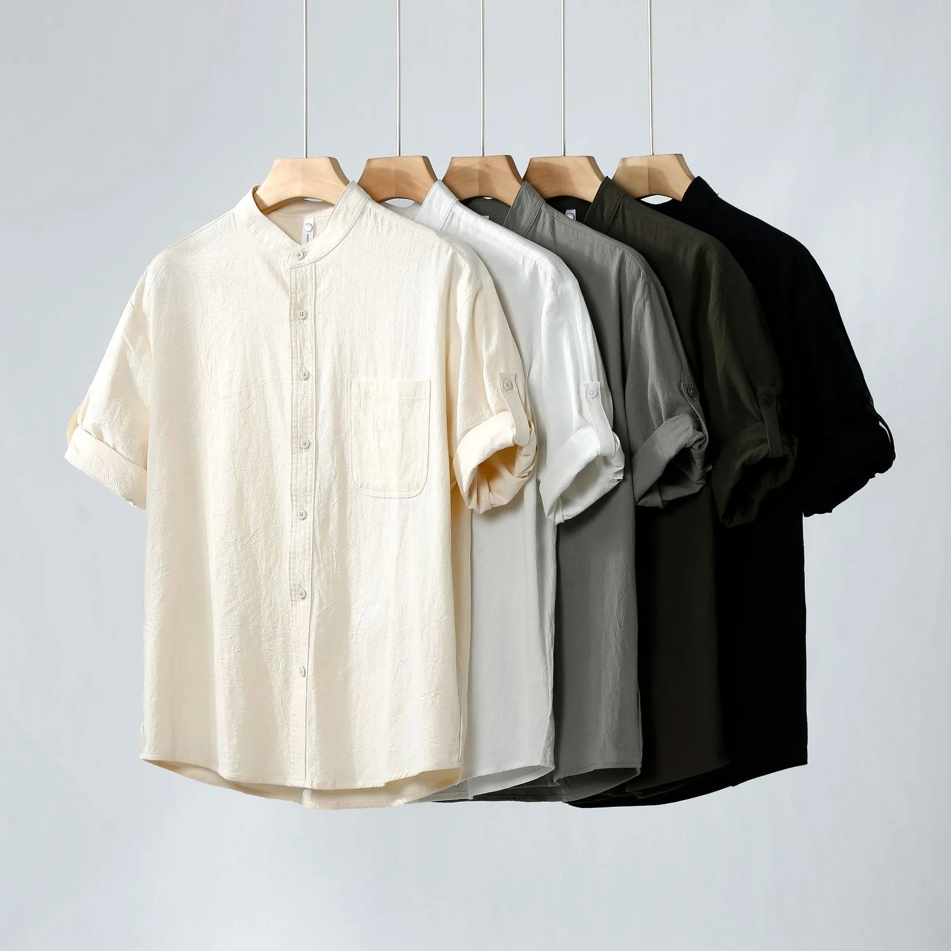 Men's loose-fit short-sleeve linen shirt in a solid colour with a stand collar.