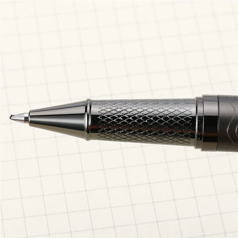 Fog gun grey metal signature pen with bullet nib and 0.5mm line width on dark table