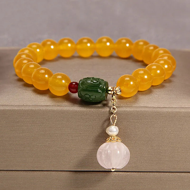 Women's yellow agate crystal bracelet on gold silk cord in khaki colour