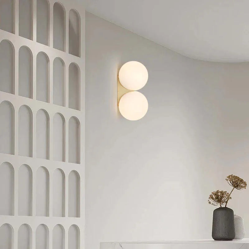 Double-headed Nordic glass ball wall lamp with gold iron finish for bedroom bedside lighting
