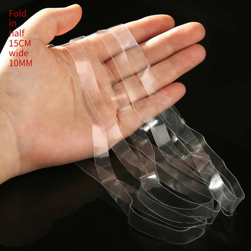 Transparent white TPU rubber bands in multiple sizes on a white background
