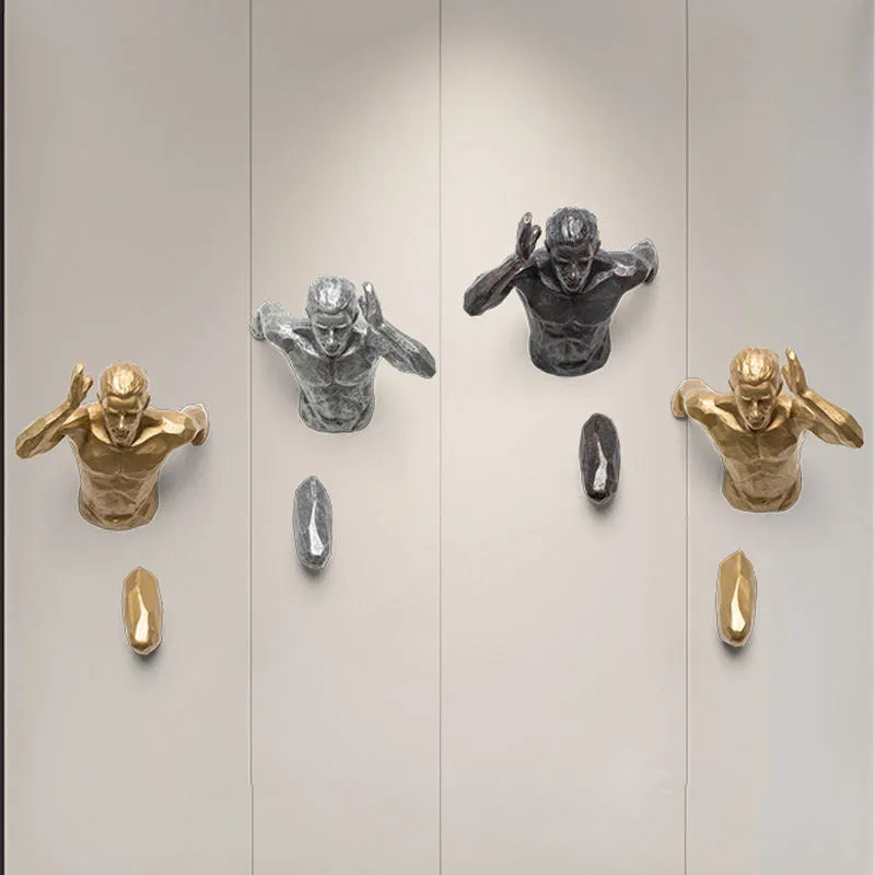 A modern, simple-style resin character sculpture for wall decoration, shown in a metallic finish.